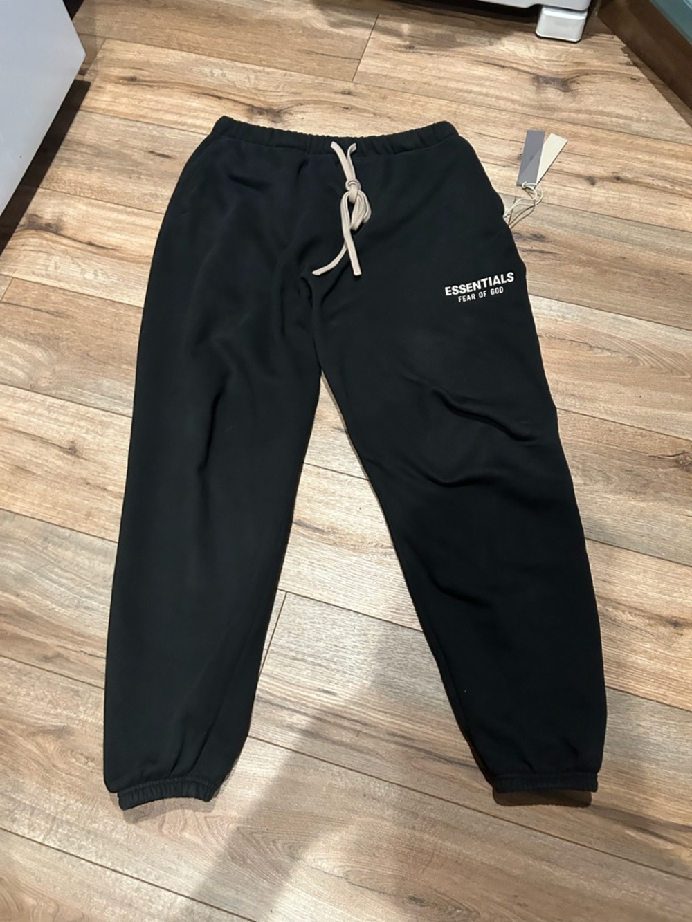 Fear of God ESSENTIALS Fleece Black Sweatpants with Cream Drawstring